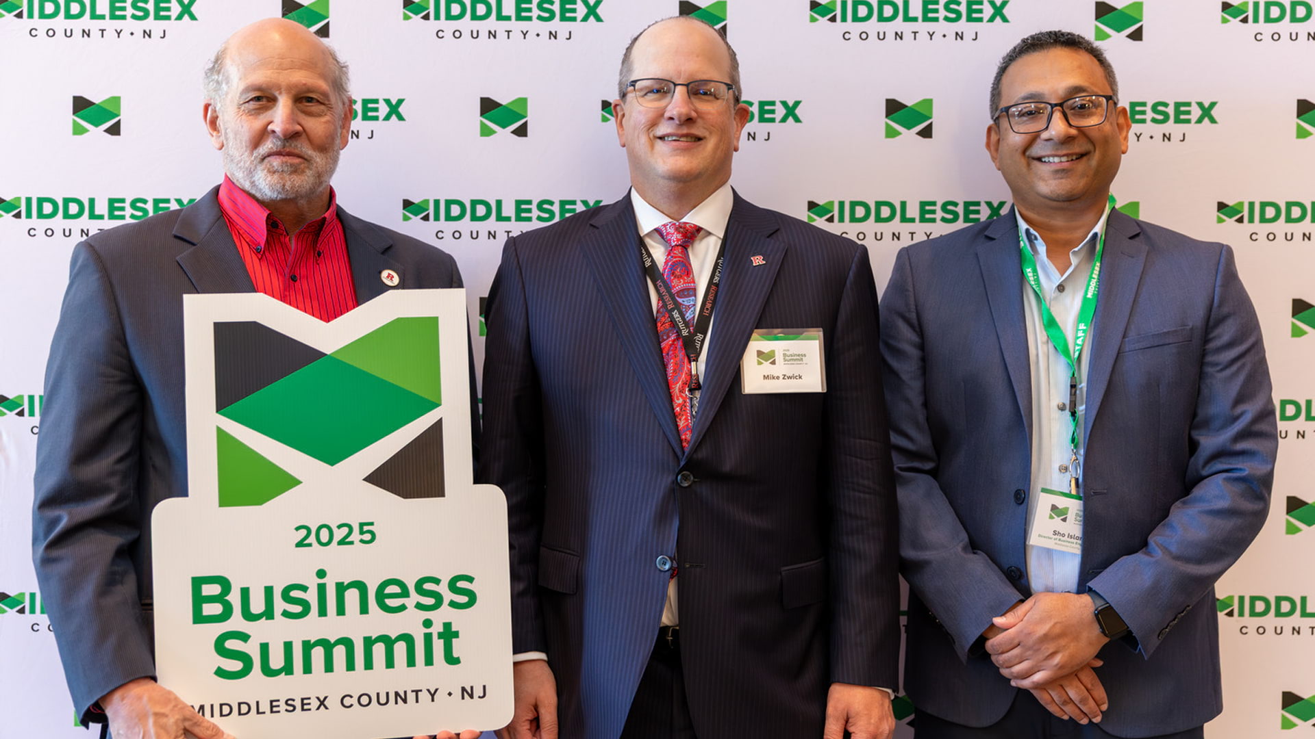 Three persons posing for a photo