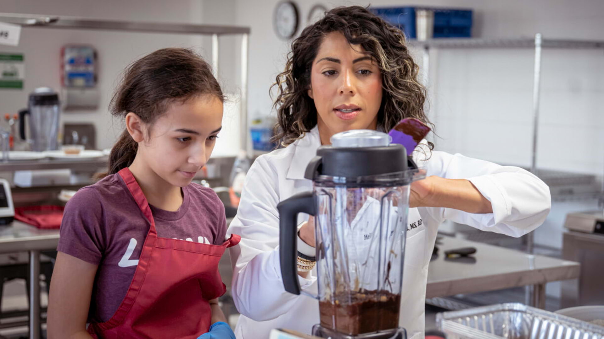 Two persons working in a kitchen