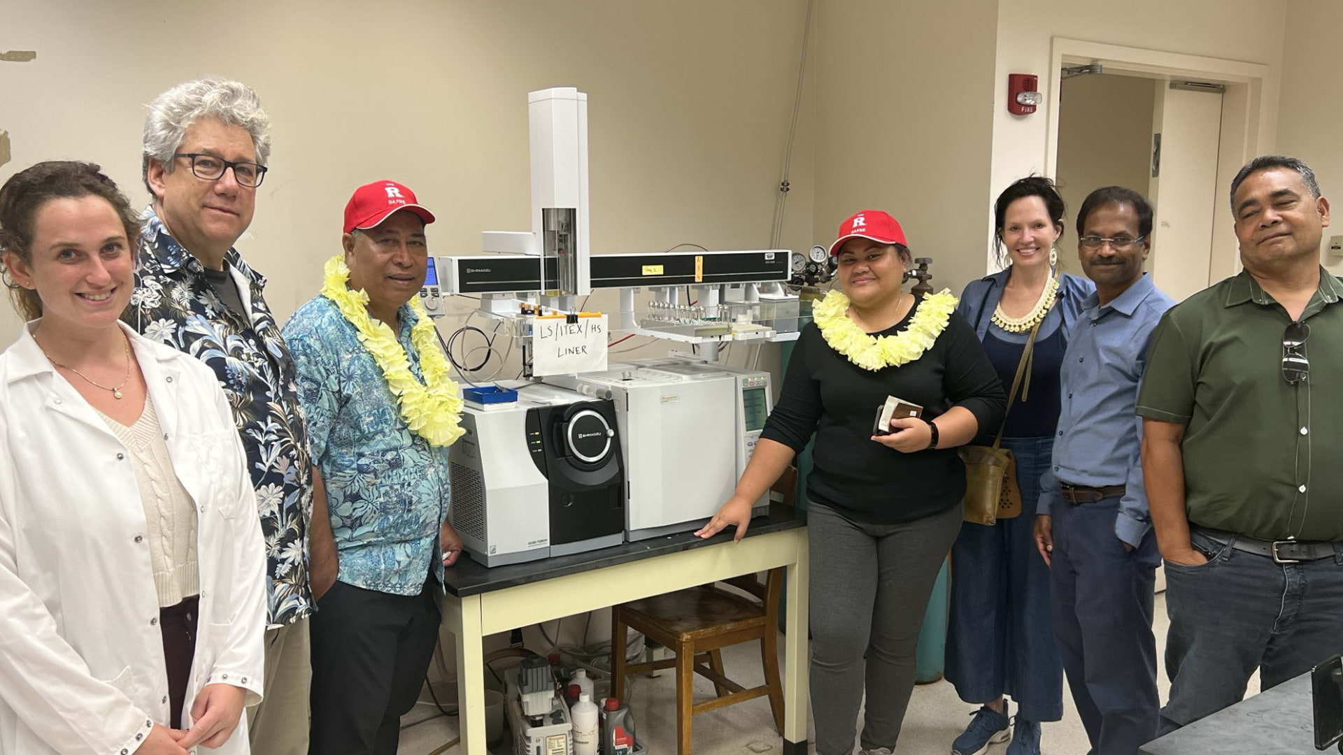 Visitors and Rutgers staff in a lab