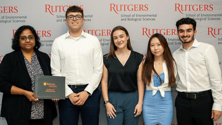 Photo of Aparna Zama and students heading to vet school